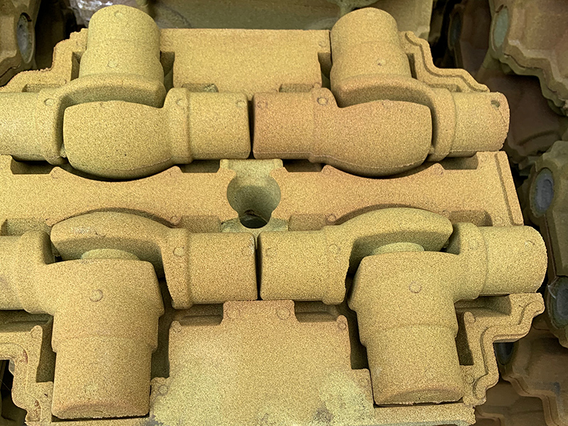 How to solve the sand sticking defect in the production of gray cast iron parts using film coated sand technology?